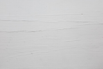Textured white surface revealing subtle details in natural lighting