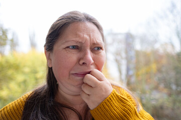 Middle-aged woman suffering from grief and pain. Emotional portrait, deep sadness, human emotion....