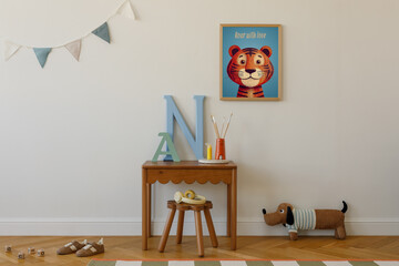 Mock up frame of tiger poster above a small wooden desk with decorative letters and art supplies — cheerful and creative kid nook.