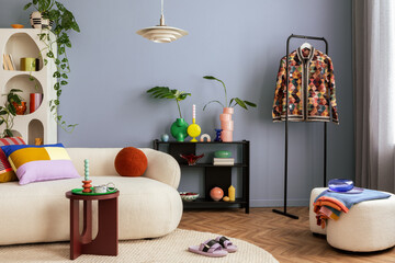Modern and colorful interior of living room with design boucle sofa, mock up poster, shelf, plants,...
