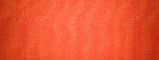 Fototapeta premium Dark orange and brick background from textile material with wicker pattern with vignette. macro.