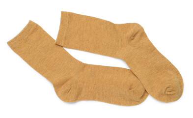 Pair of dark yellow socks isolated on white, top view