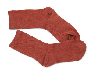 Pair of reddish brown socks isolated on white, top view