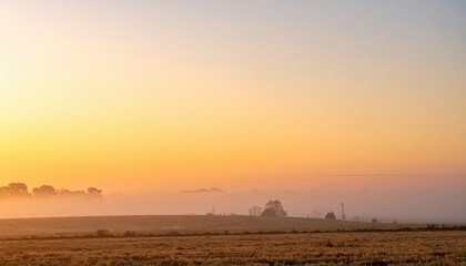 Serene sunrise over misty fields rural landscape photography peaceful environment wide view nature's beauty