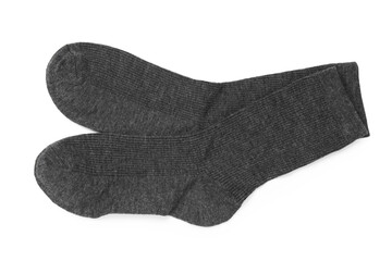 Pair of grey socks isolated on white, top view