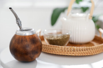 Traditional yerba mate tea on white table indoors, closeup