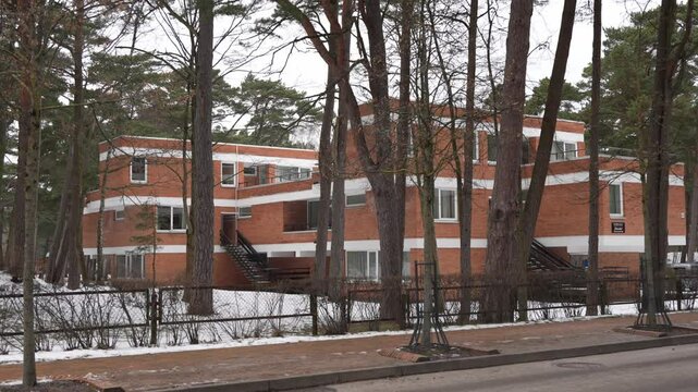 Old soviet hospital in seaside resort area. Abandoned vintage building. Cold winter morning in empty town.