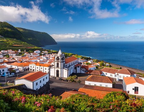 view of horta town with white houses and church on coast of faial island azores portugal