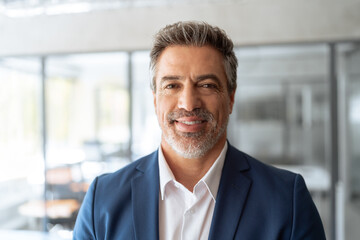 Headshot executive confident senior business man specialist smiling at camera. Closeup friendly...