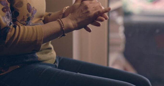 Stress, anxiety and hands of woman with nervous shaking while waiting in fear for therapy or conflict. Mental health, domestic abuse and person with problem or danger of gender based violence in home