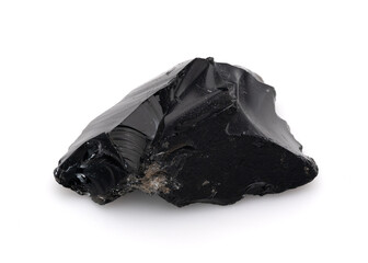Black obsidian rock isolated on white background, volcanic glass with sharp edges and reflective...