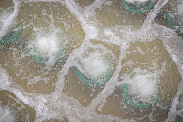 Biological treatment process in aeration basin closeup. Specialized equipment serves for breakdown...