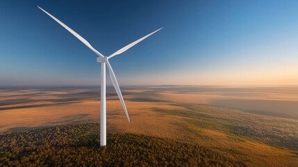 Wind Turbine Against Sunset Over Expansive Green Landscape