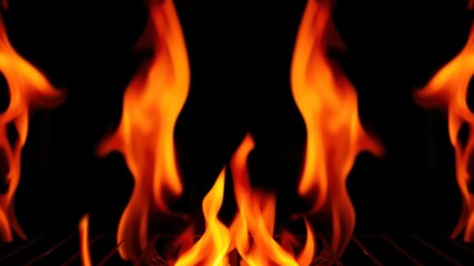 Fiery orange flames dancing on a dark grill grate, creating a symmetrical and intense visual effect
