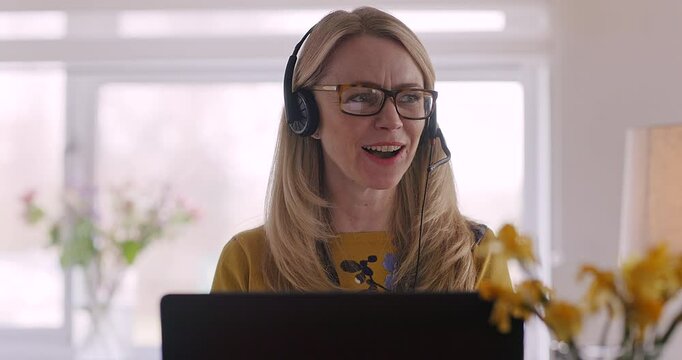 Telemarketing, customer service and woman doing an online consultation with a laptop in her home. Remote work, crm and professional female call center representative working on computer in workspace.