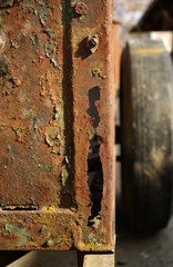 Texture of heavy corrosion on an iron sheet. Peeling old paint from an iron structure. Corrosion on...