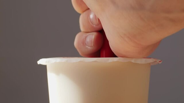 Bubble milk tea with black tapioca in plastic glass, supermarket chinese drink, tasty dessert, close up macro. 