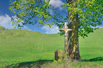 Christian wooden cross in nature