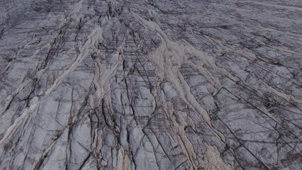 Top view of a gentle rocky snow-covered mountain slope. Mount Elbrus aerial view from a quadcopter, close-up