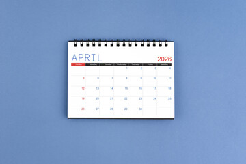 April 2026 Monthly desk calendar for 2026 year on blue color background.