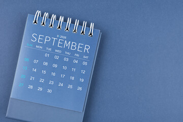 September 2026 calendar on blue background. Desk calendar for planning and organizing.