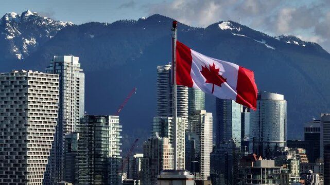 The Canadian Flag Stands Tall Against a Striking City Skyline and Mountain Backdrop, With Downtown Views From South Granville in Vancouver, Canada - Zoom In Shot