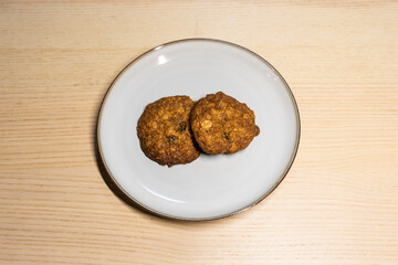 A plate of two cookies.