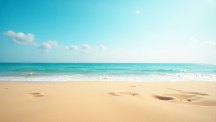 Fototapeta premium Serene Beachscape: Footprints in Golden Sand Under a Azure Sky