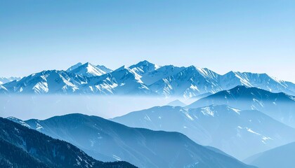 Endless mountain range with jagged snowy tops fading into cold blue mist, dramatic elevation changes capturing winter’s raw power