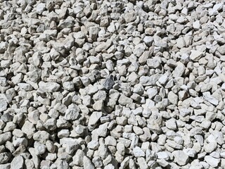 Close-up of small white stones in a textured surface, ideal for backgrounds