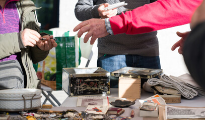 A person looking for some deals in a flea market