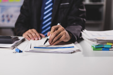 Businessman working on financial documents in the office, accounting, auditing and business...