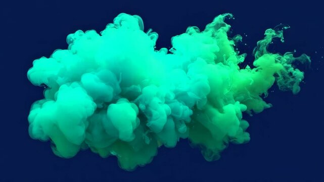 Abstract Teal and Green Ink Cloud in Water - A vibrant cloud of teal and green ink swirls and expands underwater against a deep blue background. The colors blend and diffuse creating a dynamic and eth