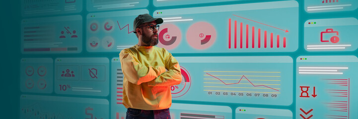 Man watching interactive data dashboard in futuristic control room filled with graphs and interface elements. Concept of business, graphics, UX analytics, tech industry, digital reporting.