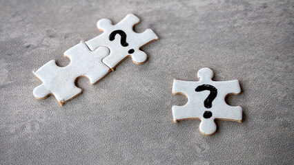 puzzle pieces written with question mark.