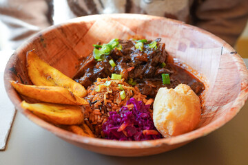 Caribbean oxtail, Jamaican fried dumpling and fried sweet plantain