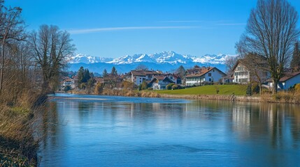 Fototapeta premium Serene river reflects Swiss village mountains