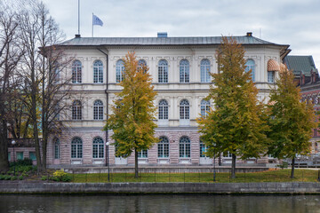 Historic Building by Canal with Autumn Trees in Stockholm, Sweden.
Classic stone building with autumn trees reflected in canal water in Stockholm, Sweden