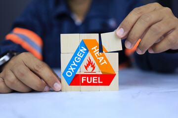 safety staff arranging wooden dice with how to control fire and behavior understanding of oxygen,...