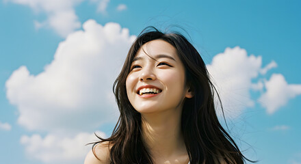 Smiling Woman Looking Up at Blue Sky with Clouds