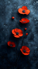 Vibrant red poppies on a dark textured background creating a dramatic and eye-catching floral display