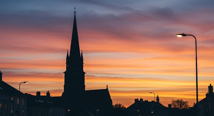 Fototapeta premium Serene Sunset Silhouette of a Church Steeple