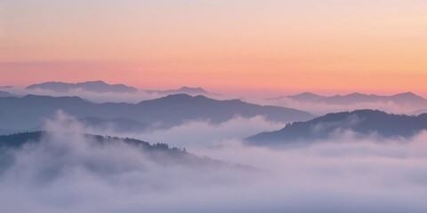 Obraz premium Soft pastel misty mountains at dawn with fog and sunrise, copy space 