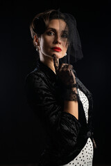 Elegant Woman in Vintage Style with Black Veil Portrait