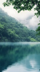 Fototapeta premium Dense green jungle surrounding the mystical Nam Ngum Lake