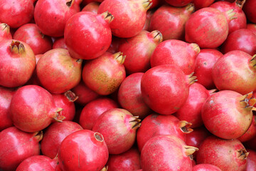 Lots of ripe pomegranate fruits on the market, pomegranate backgrounds