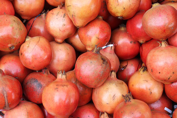 Lots of healthy pomegranate fruits on the market
