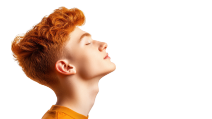 Curious redhaired boy gazing upwards in wonder and awe