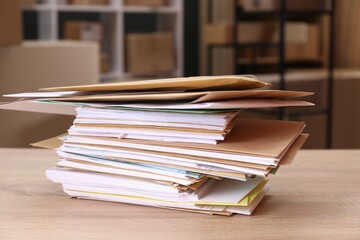 Many different envelopes on table in post office