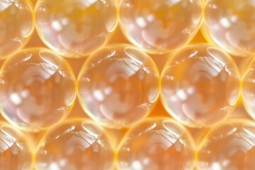 Close-up view of many translucent, golden spheres